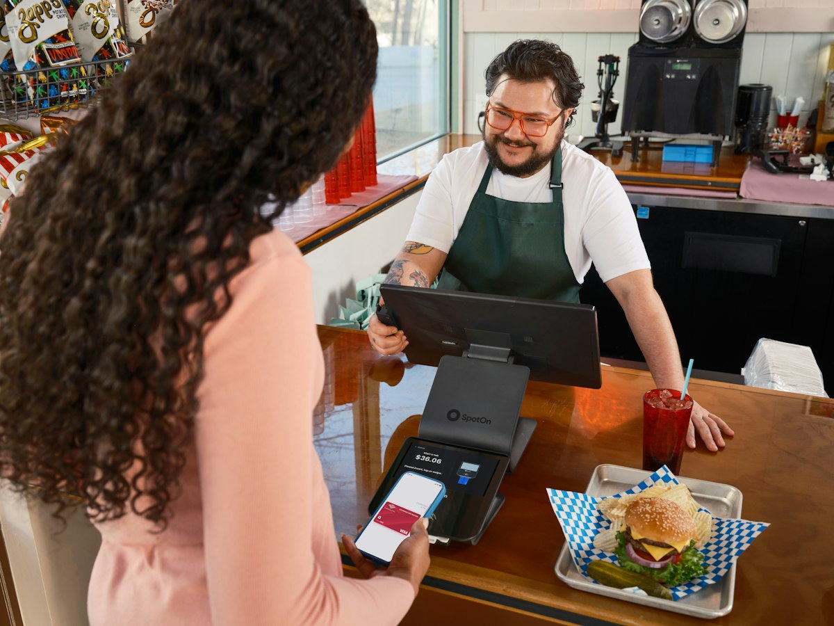 Customer paying at a restaurant counter
