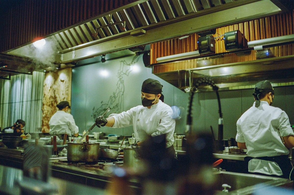 Chefs at work in a restaurant kitchen